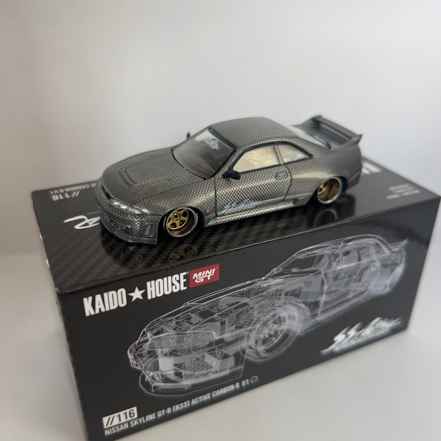 Mini GT x Kaido House Nissan Skyline R33 GTR Active Carbon V1 Chase #116