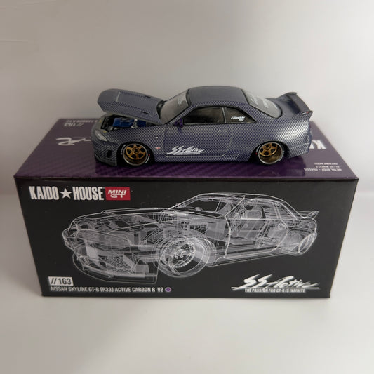Mini GT x Kaido House Nissan Skyline R33 GTR Active Carbon Chase #163